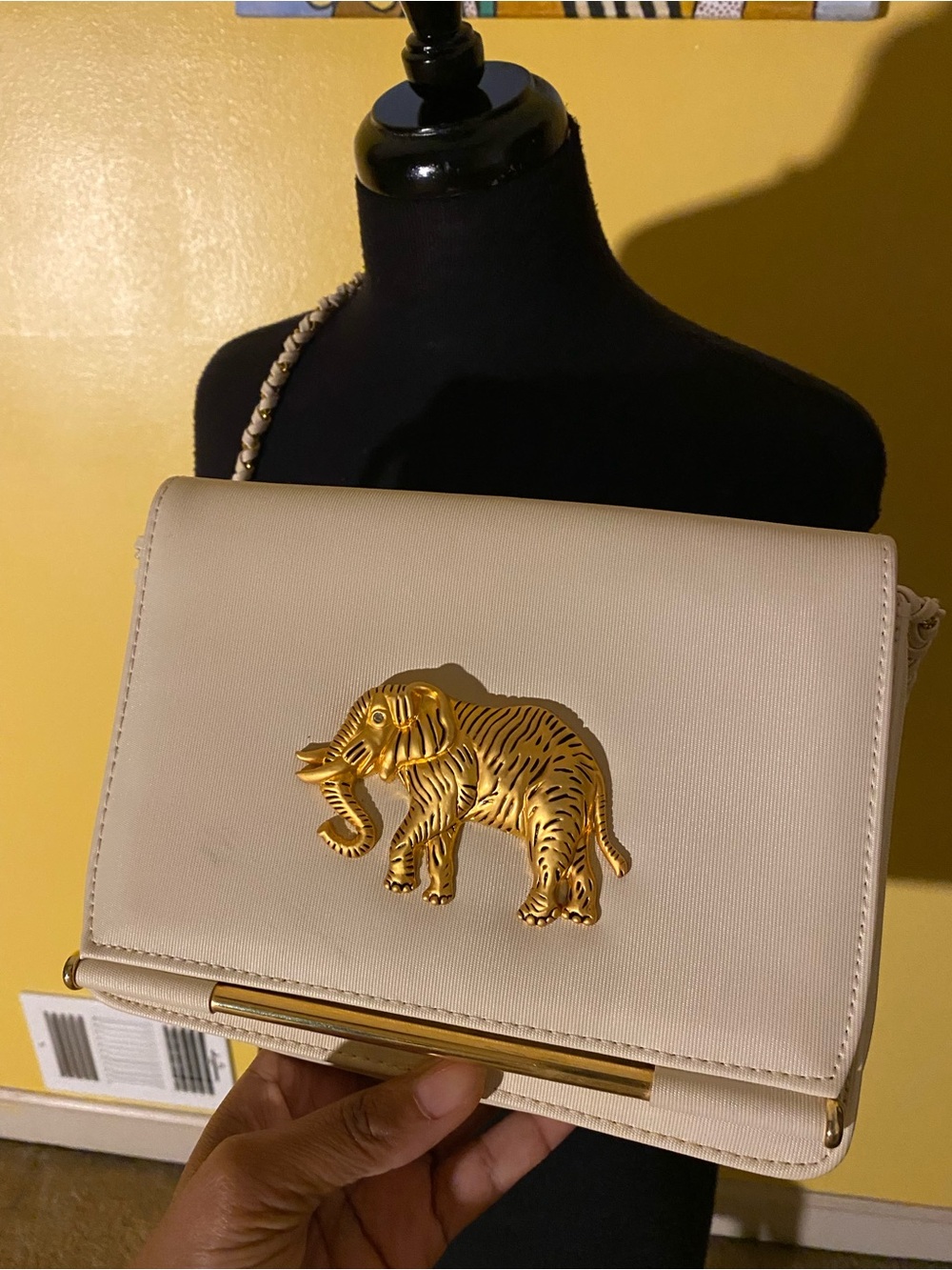 Elegant Cream Crossbody Bag with Gold Elephant Accent